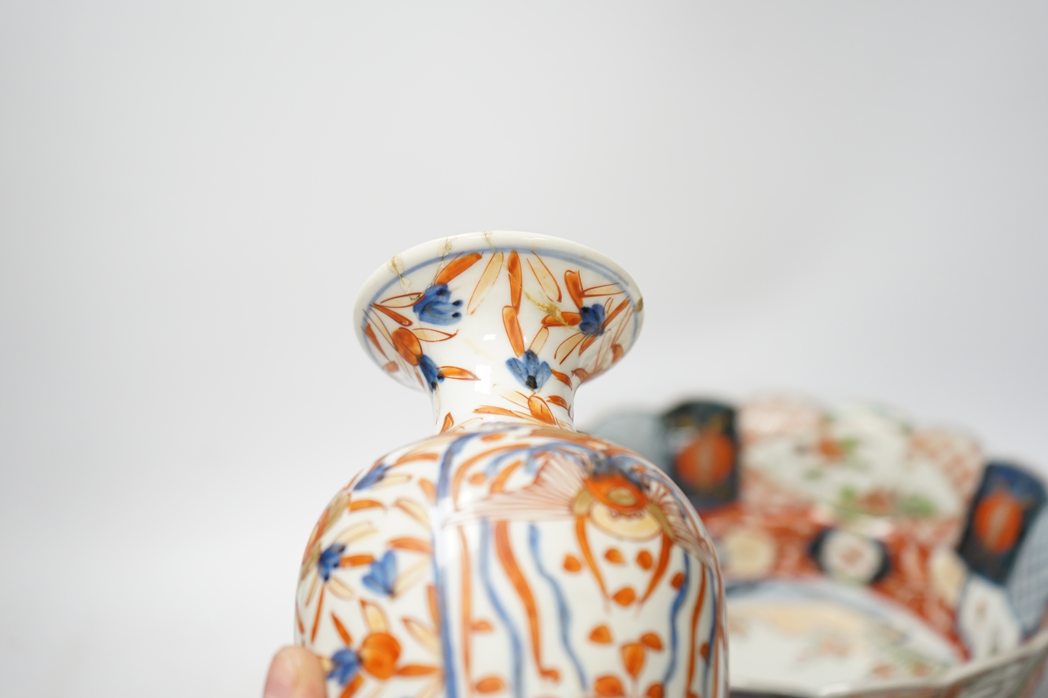 Japanese ceramics to include an Imari vase and bowl and a blue and white dish, 22cm diameter. Condition - two bowls and dish good, others poor